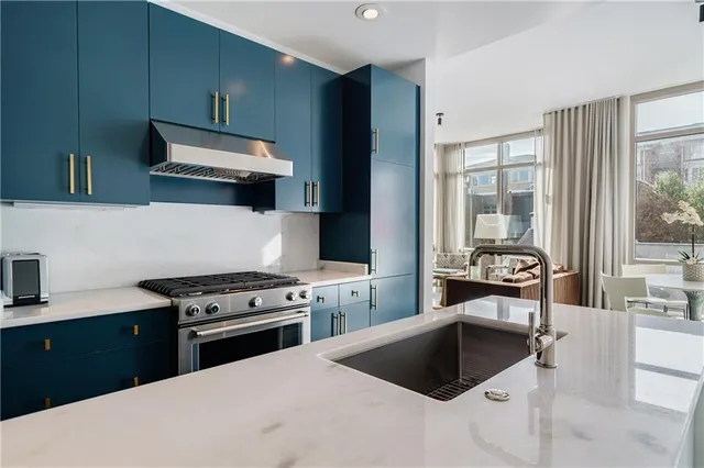 a kitchen with a stove and a sink