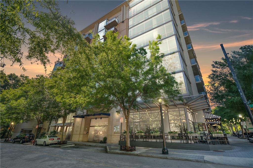 905 Juniper Street Northeast, Unit 405 Atlanta, GA 30309 - Photo 27 of 34 a view of a tall building next to a road