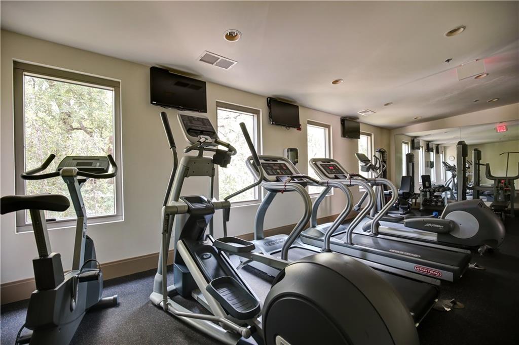 905 Juniper Street Northeast, Unit 405 Atlanta, GA 30309 - Photo 31 of 34 a view of a room with gym equipment