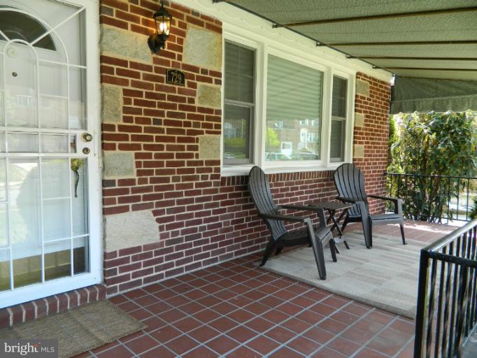 729 Charing Cross Road Baltimore, MD 21229 - Photo 12 of 26 a view of balcony with wooden floor and chair