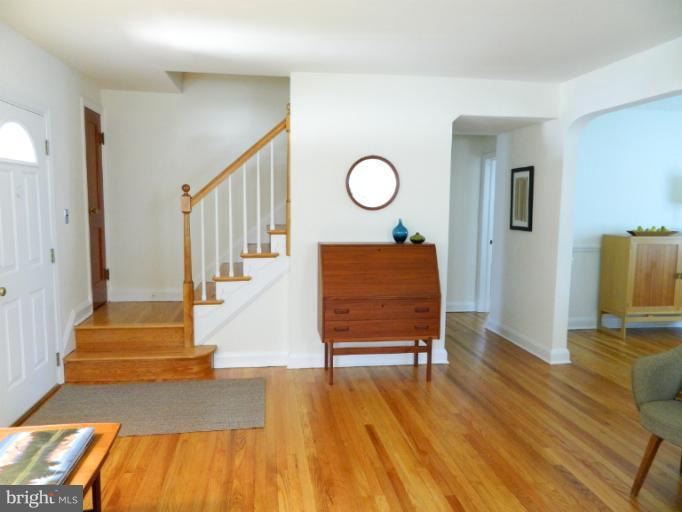 729 Charing Cross Road Baltimore, MD 21229 - Photo 18 of 26 a living room with wooden floor furniture and a wooden floor