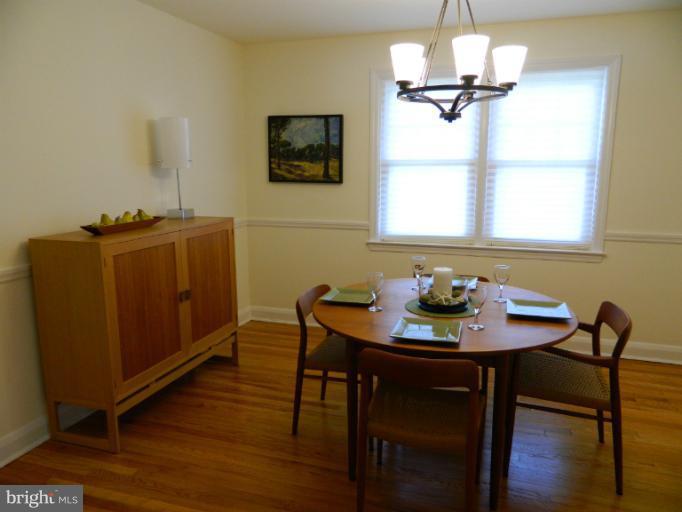 729 Charing Cross Road Baltimore, MD 21229 - Photo 19 of 26 a view of a dining room with furniture window and wooden floor
