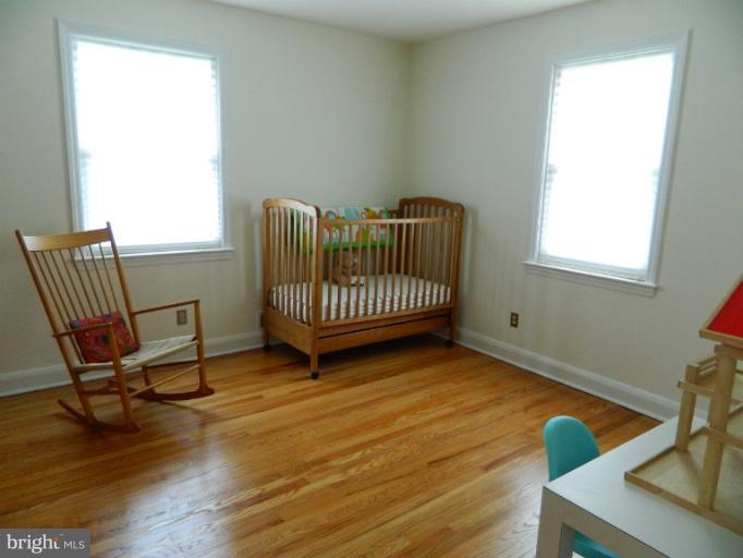 729 Charing Cross Road Baltimore, MD 21229 - Photo 20 of 26 a view of a room with wooden floor and windows