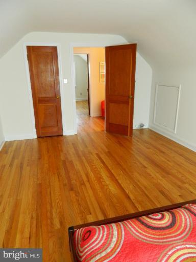 729 Charing Cross Road Baltimore, MD 21229 - Photo 24 of 26 a view of an empty room with wooden floor