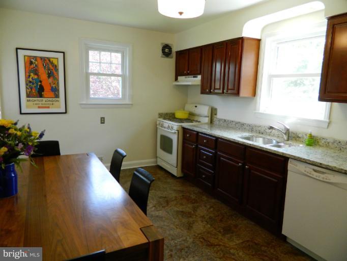 729 Charing Cross Road Baltimore, MD 21229 - Photo 5 of 26 a kitchen with a sink cabinets and window
