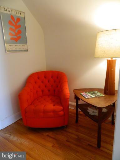 729 Charing Cross Road Baltimore, MD 21229 - Photo 6 of 26 a workspace with furniture and wooden floor