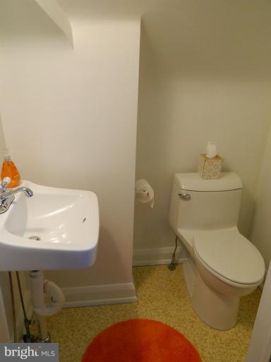 729 Charing Cross Road Baltimore, MD 21229 - Photo 7 of 26 a bathroom with a sink and a toilet