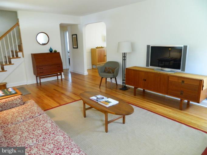 729 Charing Cross Road Baltimore, MD 21229 - Photo 8 of 26 a living room with furniture and a flat screen tv