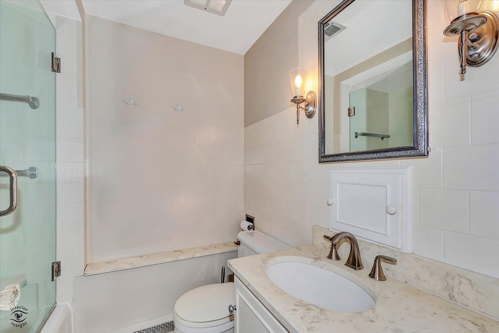 920 Juniper Road Glenview, IL 60025 - Photo 13 of 25 a bathroom with a granite countertop toilet sink and mirror