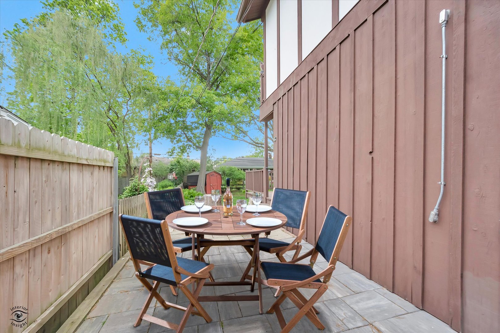 920 Juniper Road Glenview, IL 60025 - Photo 18 of 25 a view of a patio with a table and chairs