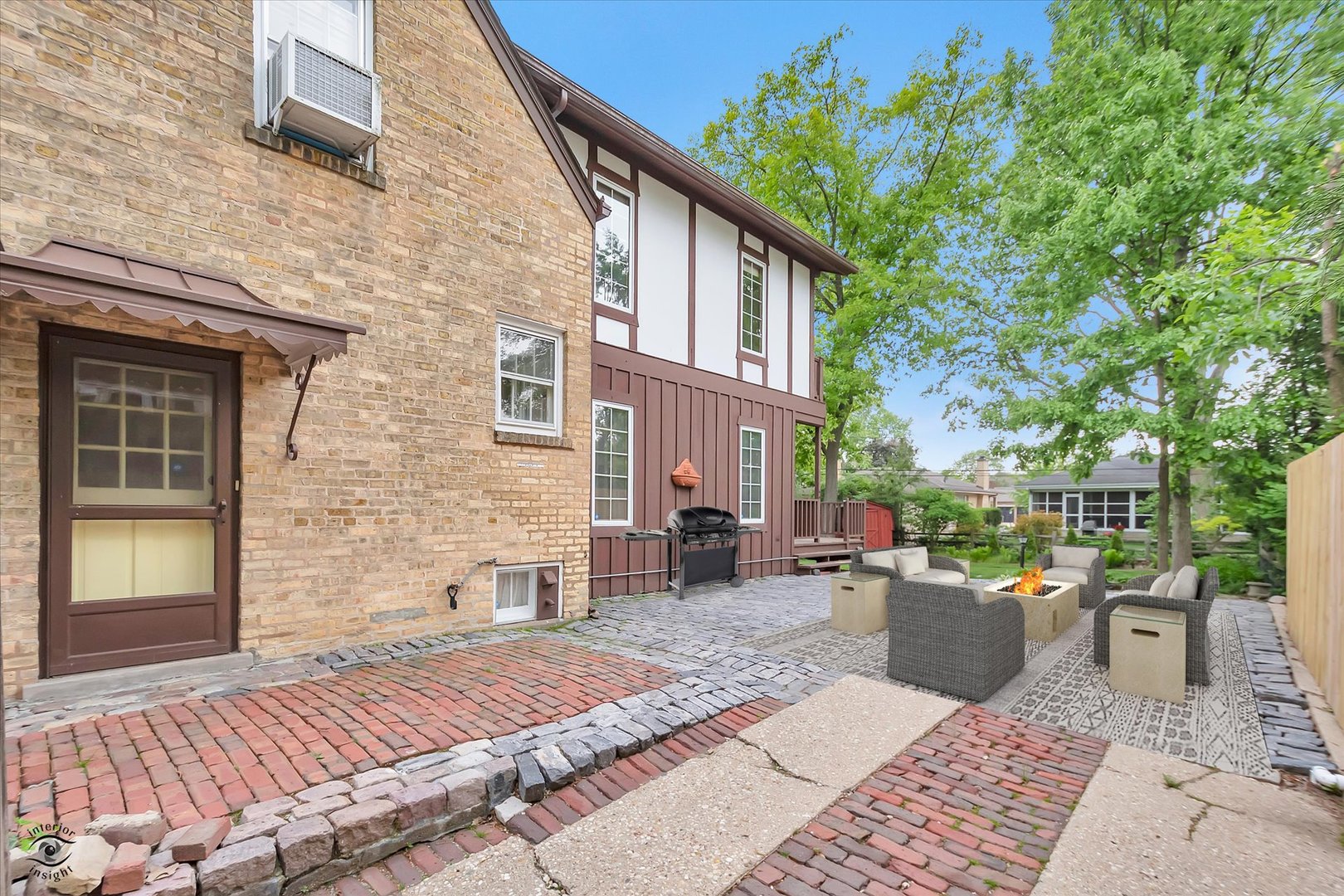 920 Juniper Road Glenview, IL 60025 - Photo 19 of 25 a view of a patio with couches and table and chairs and potted plants