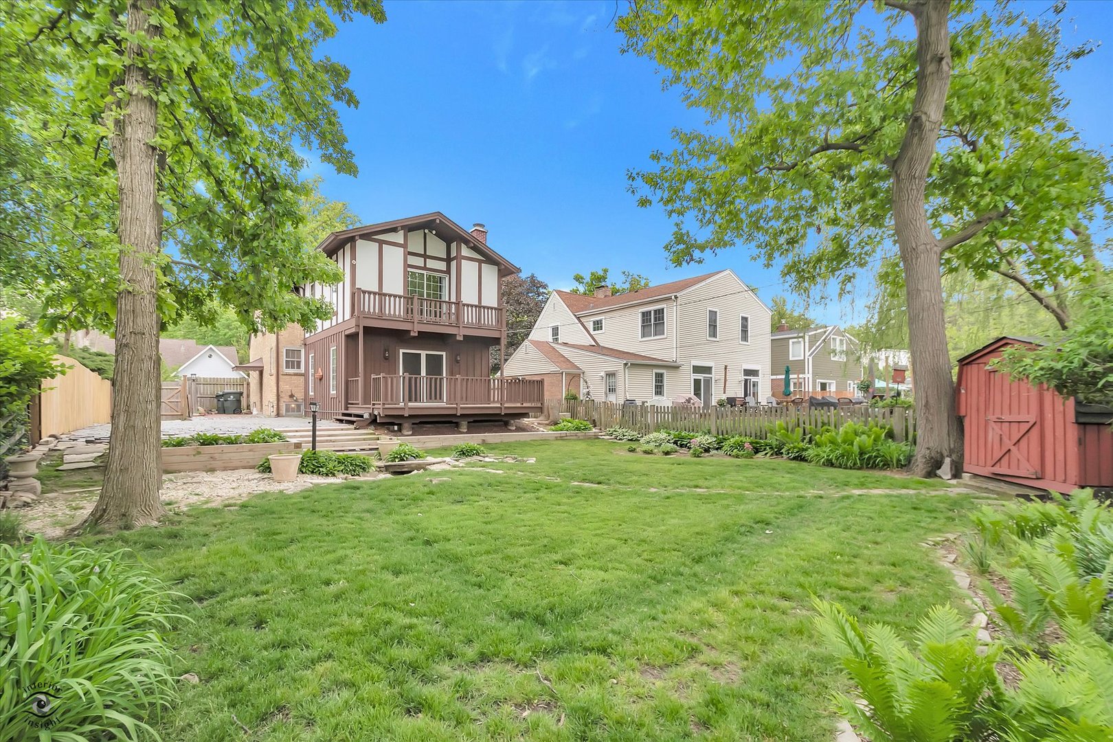 920 Juniper Road Glenview, IL 60025 - Photo 21 of 25 a view of a house with a big yard and large trees