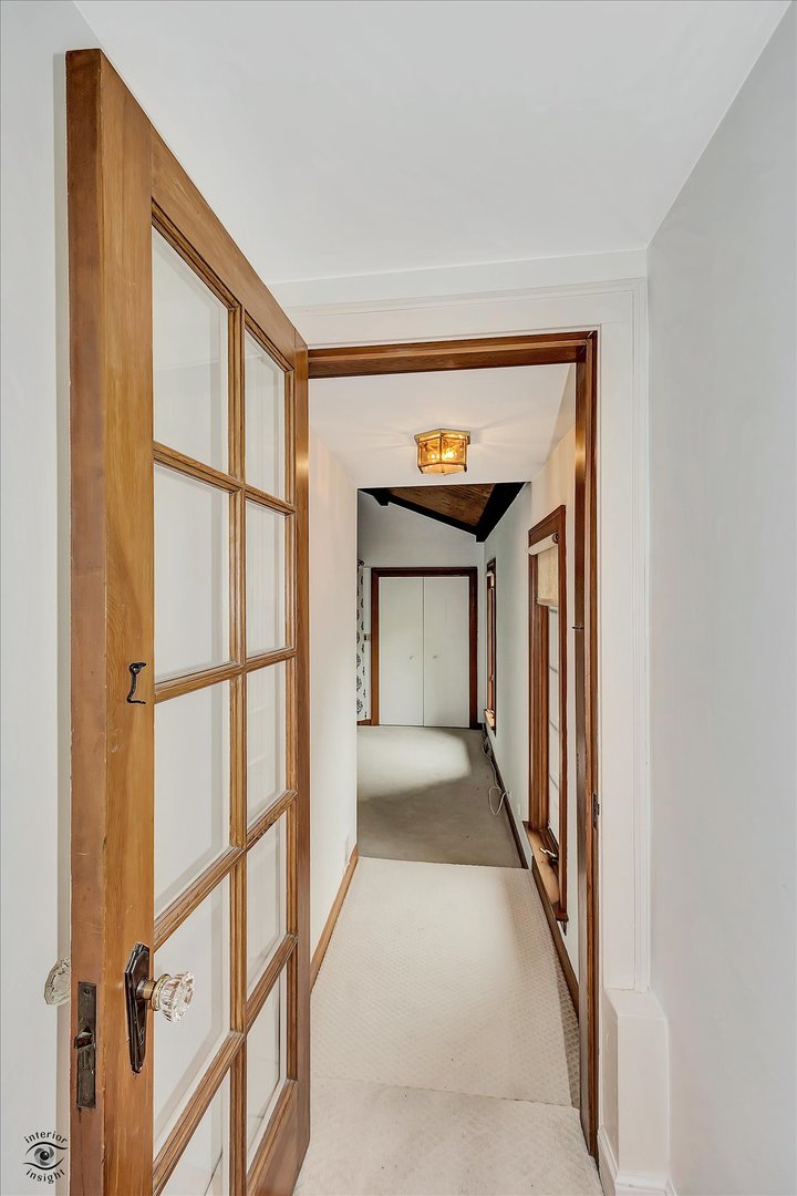 920 Juniper Road Glenview, IL 60025 - Photo 8 of 25 a view of a hallway with windows