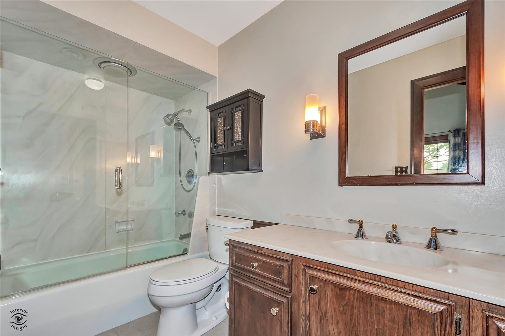 920 Juniper Road Glenview, IL 60025 - Photo 10 of 25 a bathroom with a granite countertop sink toilet and shower