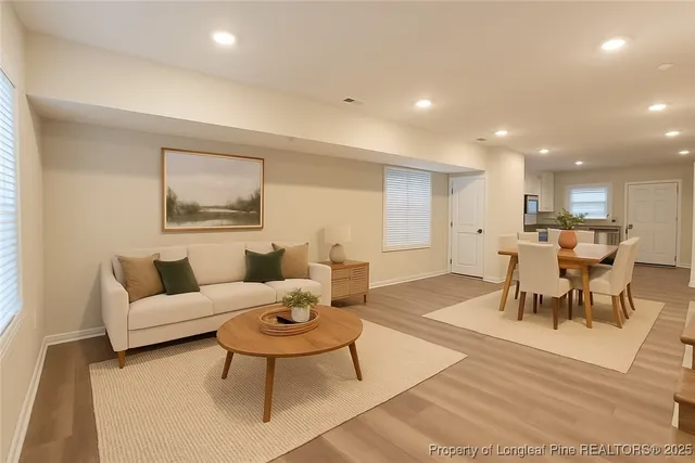 a living room with furniture and a table