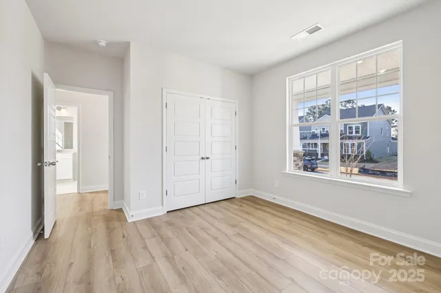 a bathroom with a shower sink vanity mirror and toilet