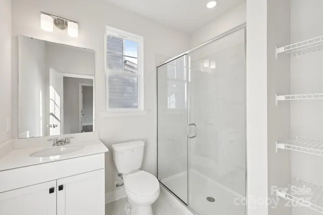 a view of a closet with racks on the wall