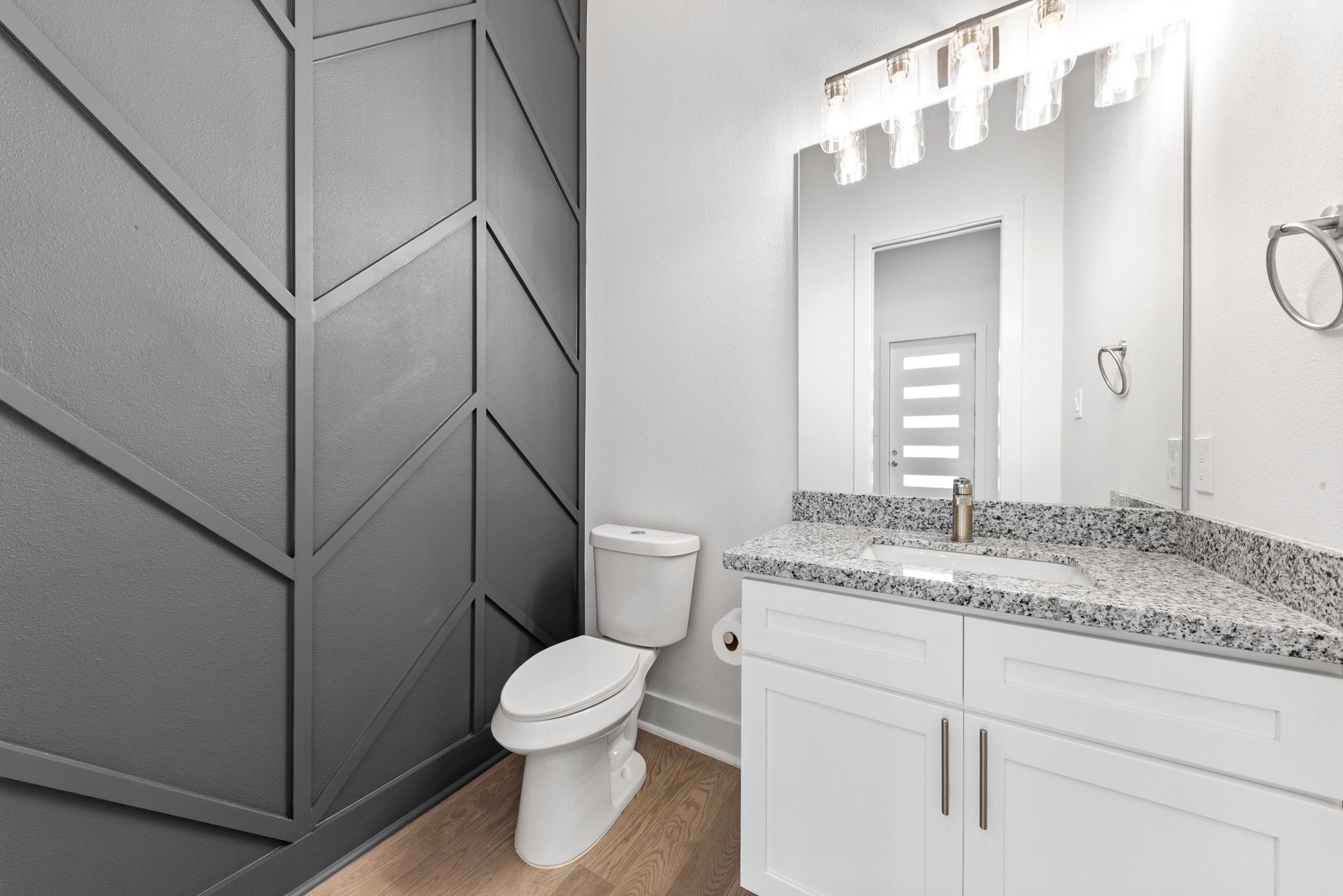 4710 Gunter Street Houston, TX 77020 - Photo 13 of 32 a bathroom with a granite countertop sink mirror vanity and toilet