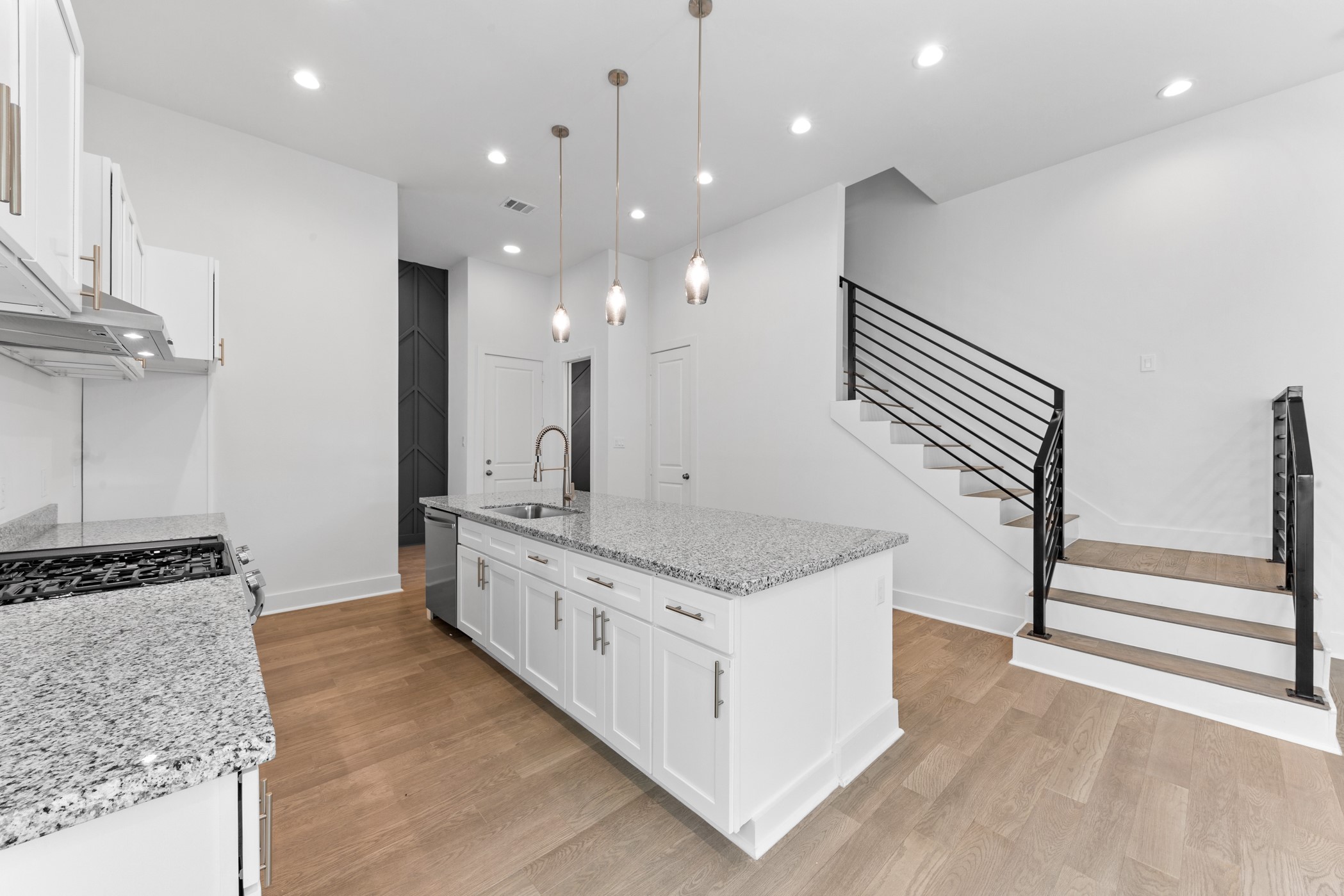4710 Gunter Street Houston, TX 77020 - Photo 9 of 32 a kitchen with stainless steel appliances granite countertop a stove and a sink