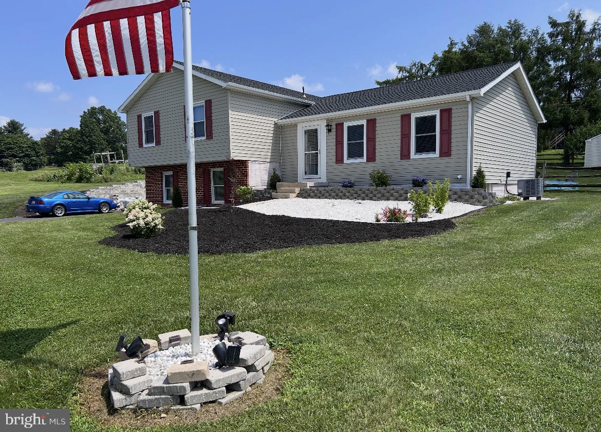 410 Shorbs Hill Road Hanover, PA 17331 - Photo 1 of 33 a front view of a house with a garden and patio