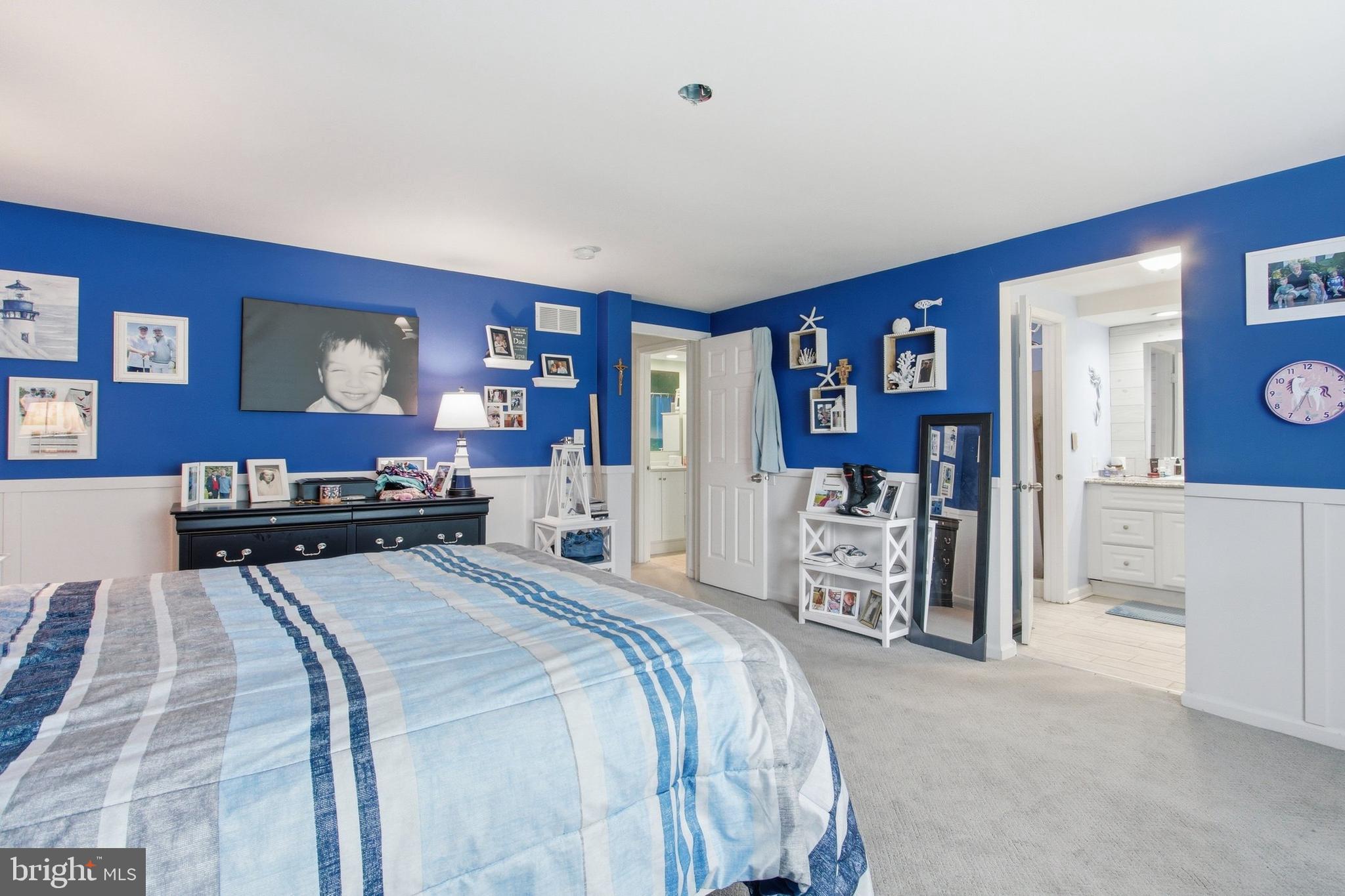 410 Shorbs Hill Road Hanover, PA 17331 - Photo 15 of 33 a large bedroom with a bed and a flat screen tv