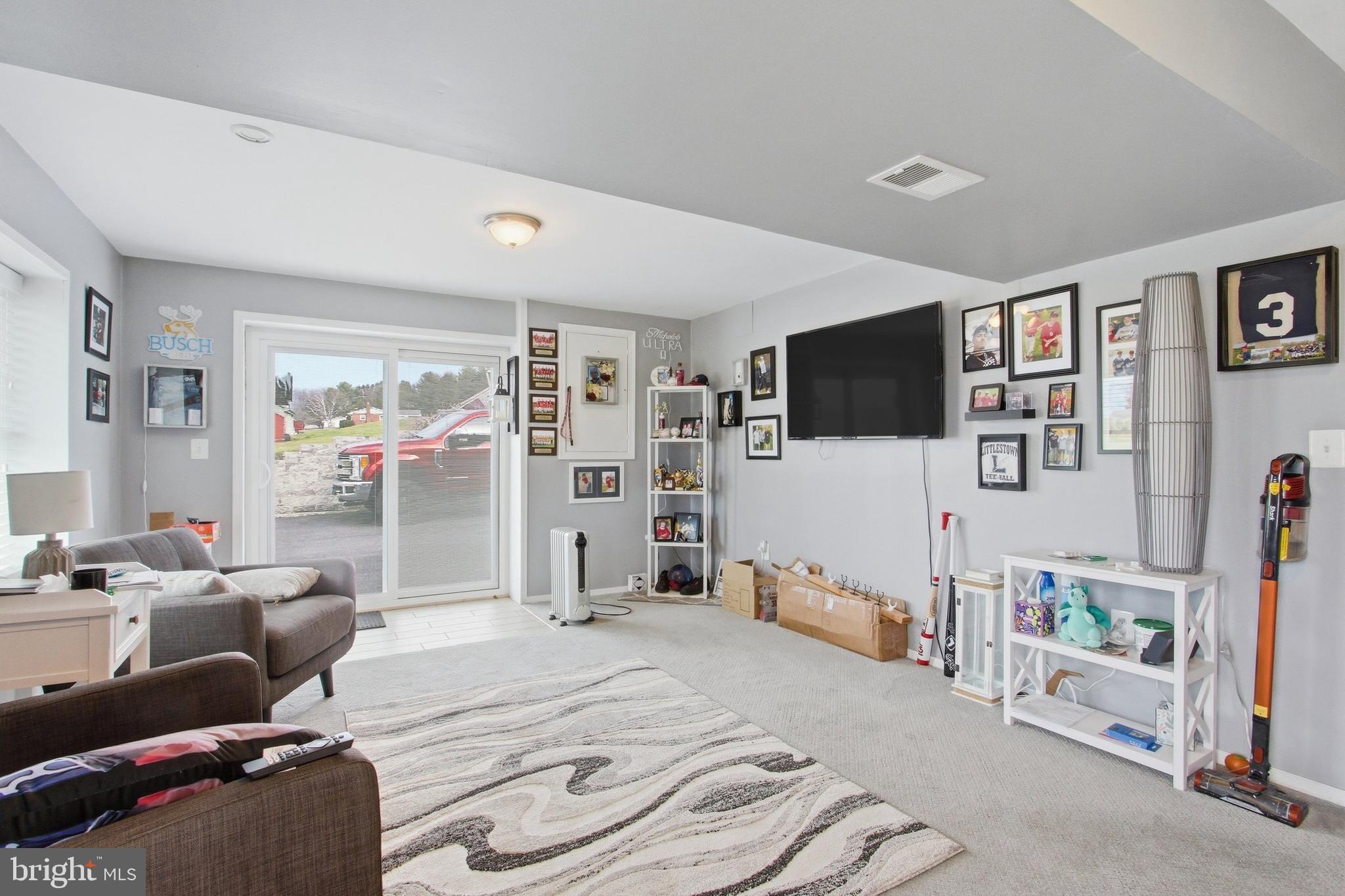 410 Shorbs Hill Road Hanover, PA 17331 - Photo 23 of 33 a bedroom with furniture and a flat screen tv