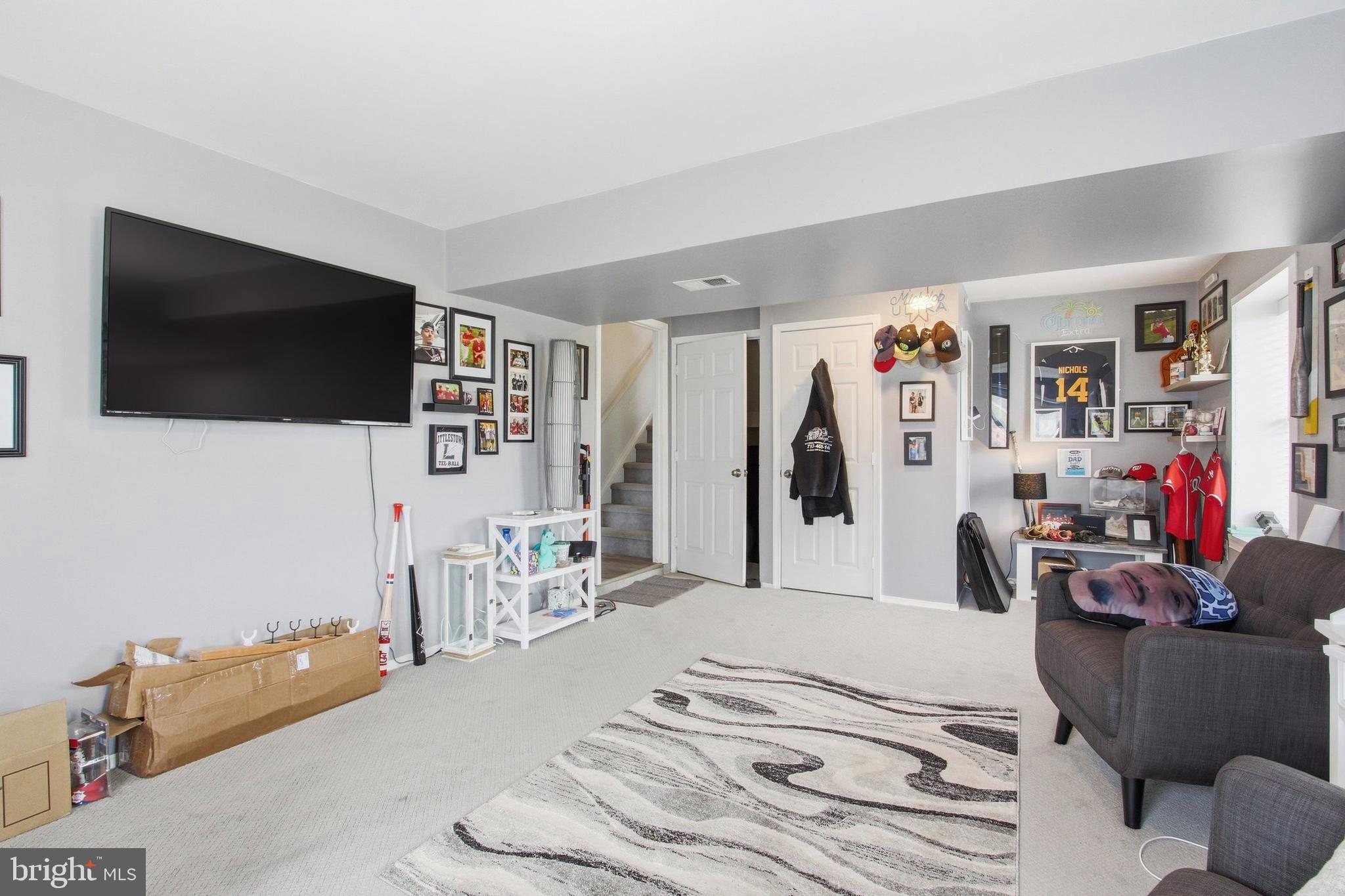 410 Shorbs Hill Road Hanover, PA 17331 - Photo 24 of 33 a living room with furniture and a flat screen tv