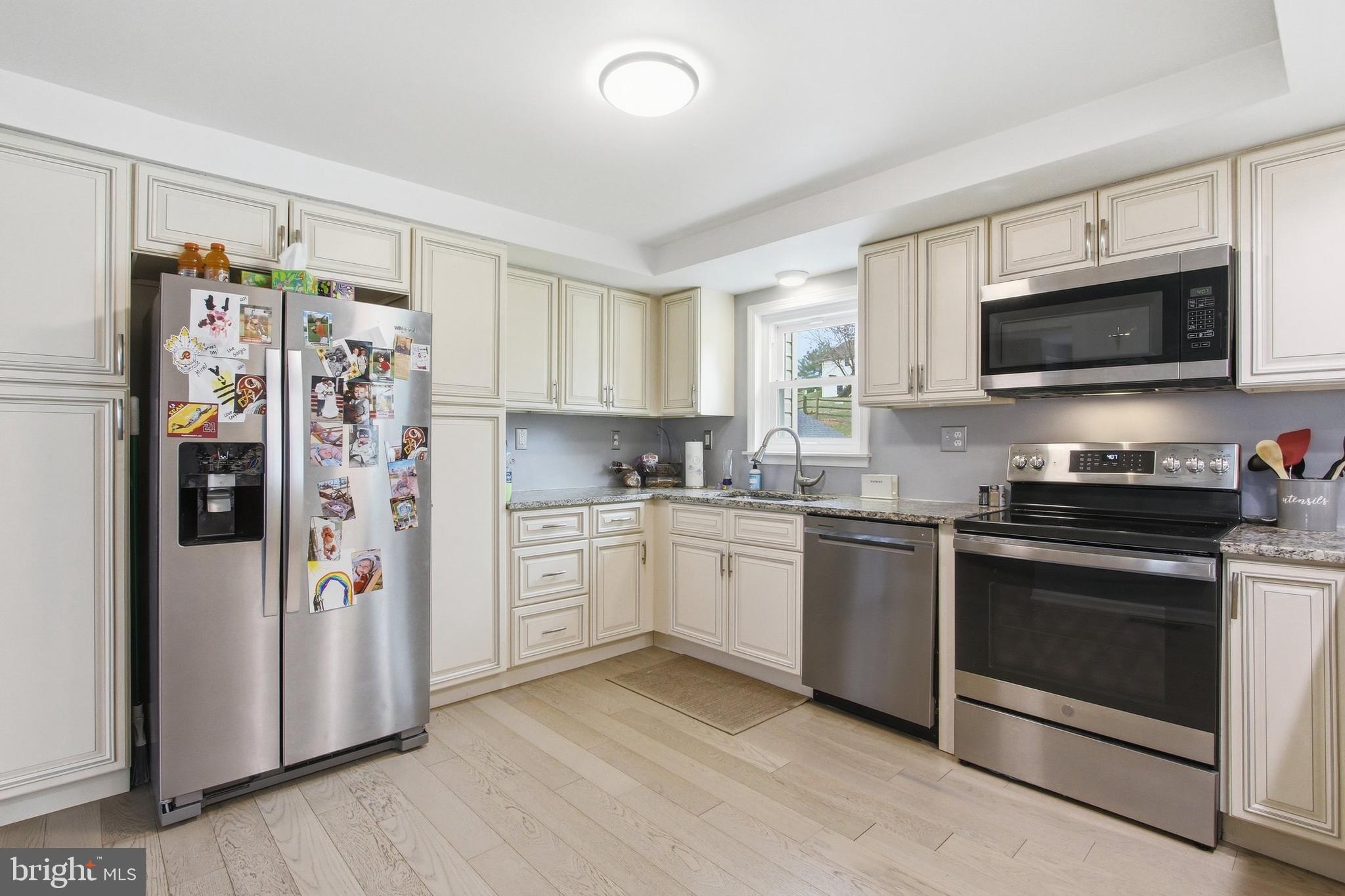 410 Shorbs Hill Road Hanover, PA 17331 - Photo 7 of 33 a kitchen with stainless steel appliances granite countertop a refrigerator stove and sink