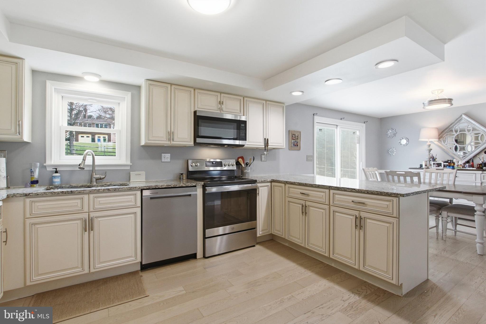410 Shorbs Hill Road Hanover, PA 17331 - Photo 8 of 33 a kitchen with sink a microwave and cabinets