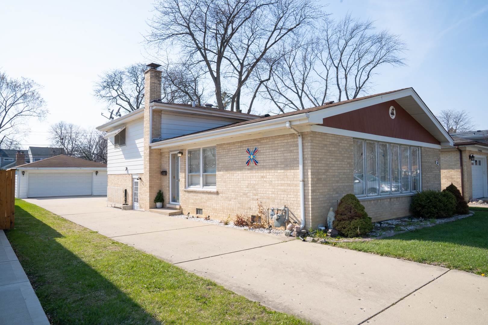 214 South Mt Prospect Road Mount Prospect, IL 60056 - Photo 1 of 25 a front view of a house with garden