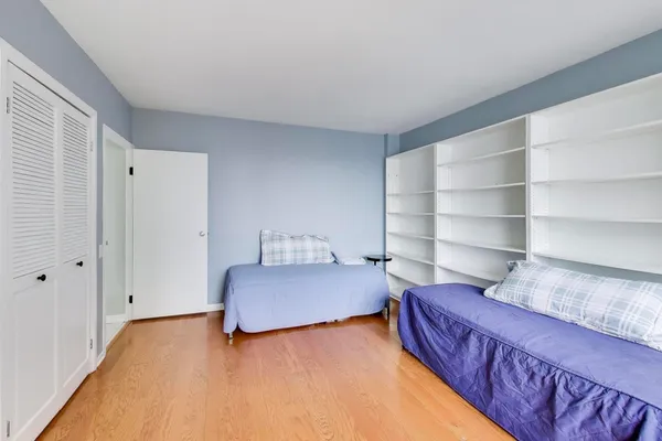 a bedroom with a bed and closet