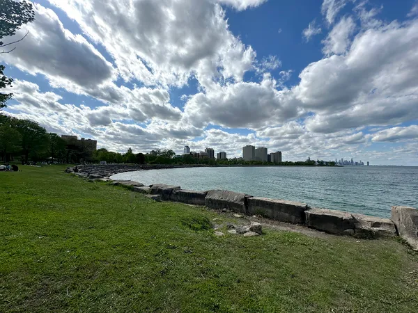a view of a lake with a yard