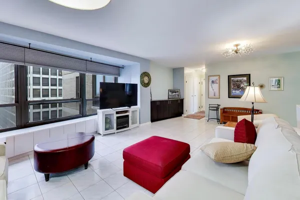 a living room with furniture and a flat screen tv