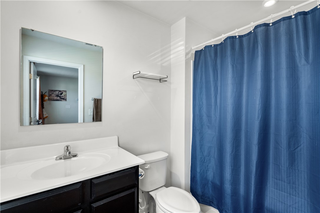 115 Queens Mill Court Pendleton, SC 29670 - Photo 20 of 32 Clean lines and a dark vanity define this functional guest bathroom layout.