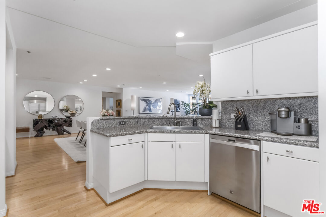 10724 Wilshire Boulevard, Unit 1005 Los Angeles, CA 90024 - Photo 18 of 45 a kitchen with sink and cabinets