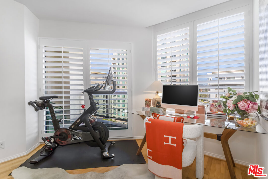 10724 Wilshire Boulevard, Unit 1005 Los Angeles, CA 90024 - Photo 20 of 45 a view of a workspace with furniture and a window