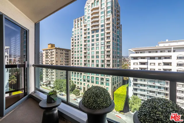 a view of a balcony and chairs