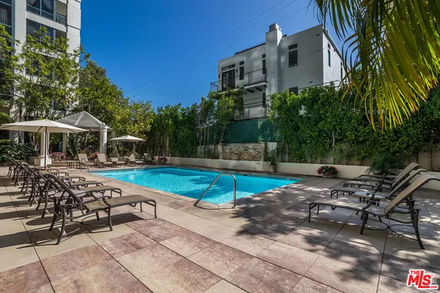 a view of a swimming pool with a patio