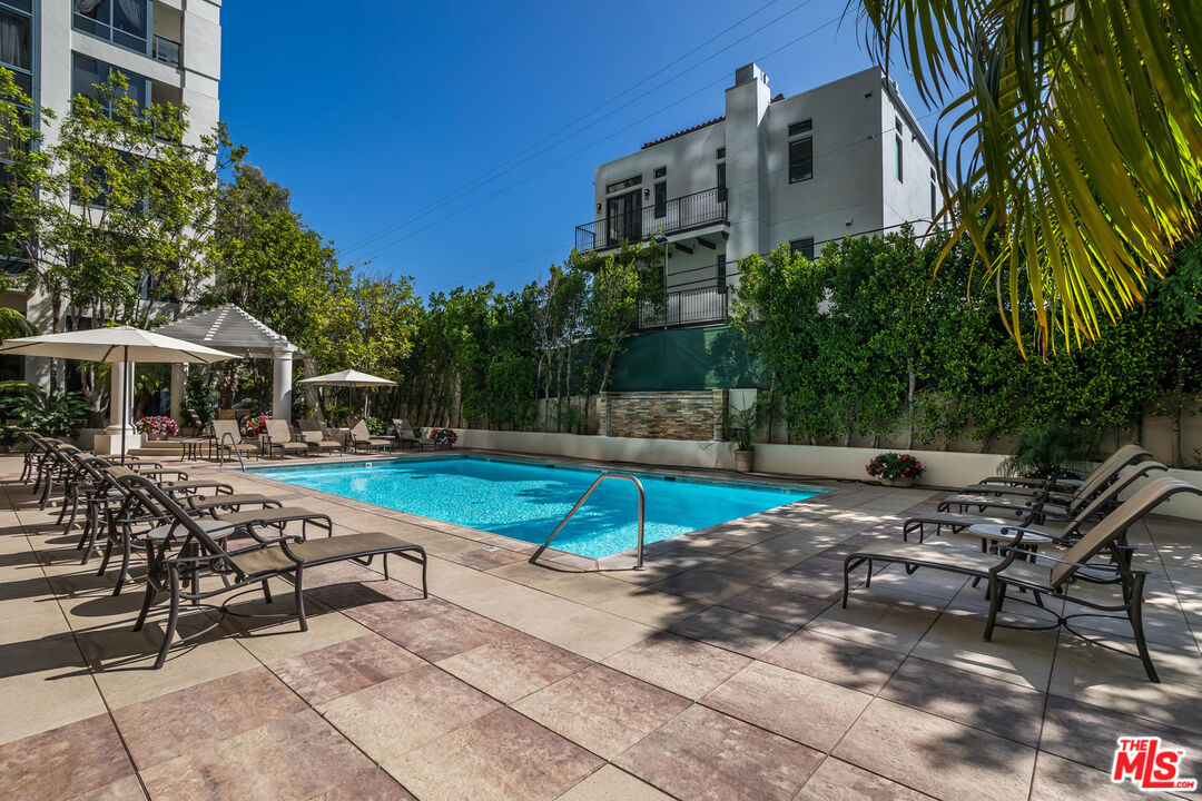 10724 Wilshire Boulevard, Unit 1005 Los Angeles, CA 90024 - Photo 39 of 45 a view of a swimming pool with a patio