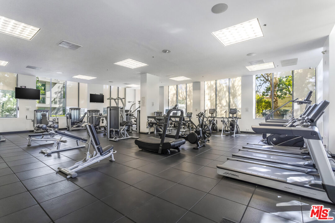 10724 Wilshire Boulevard, Unit 1005 Los Angeles, CA 90024 - Photo 42 of 45 a view of a room with lots of tables and chairs