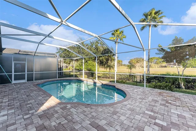 a view of a swimming pool with a patio