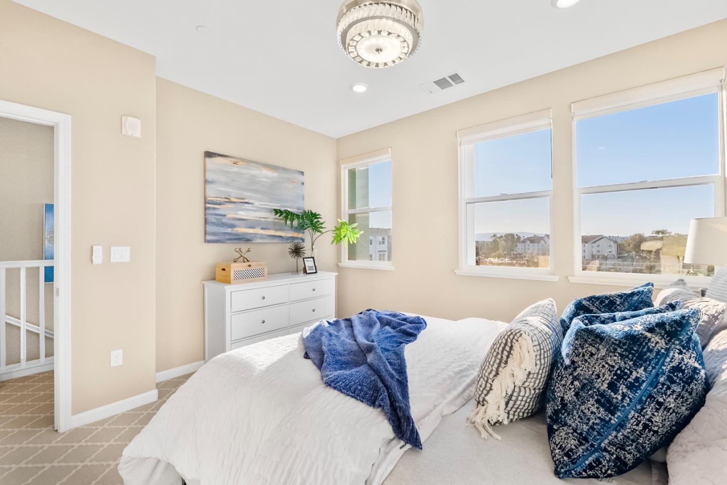 1306 Thistle Place Milpitas, CA 95035 - Photo 20 of 43 a bedroom with a large bed and a window