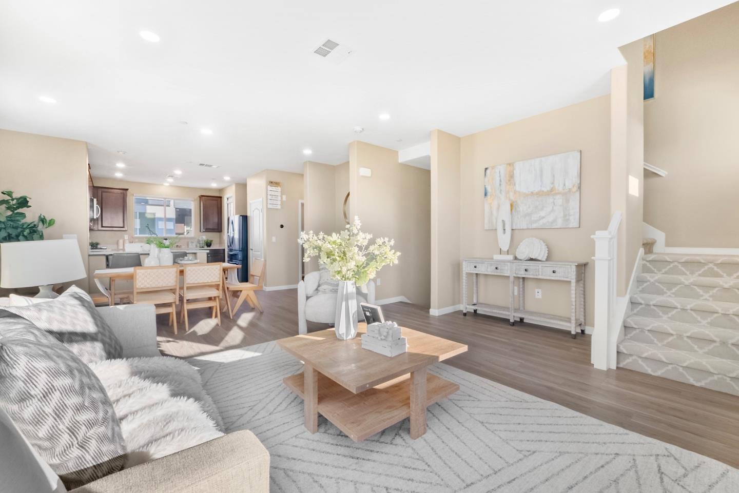 1306 Thistle Place Milpitas, CA 95035 - Photo 2 of 43 a living room with furniture and a chandelier