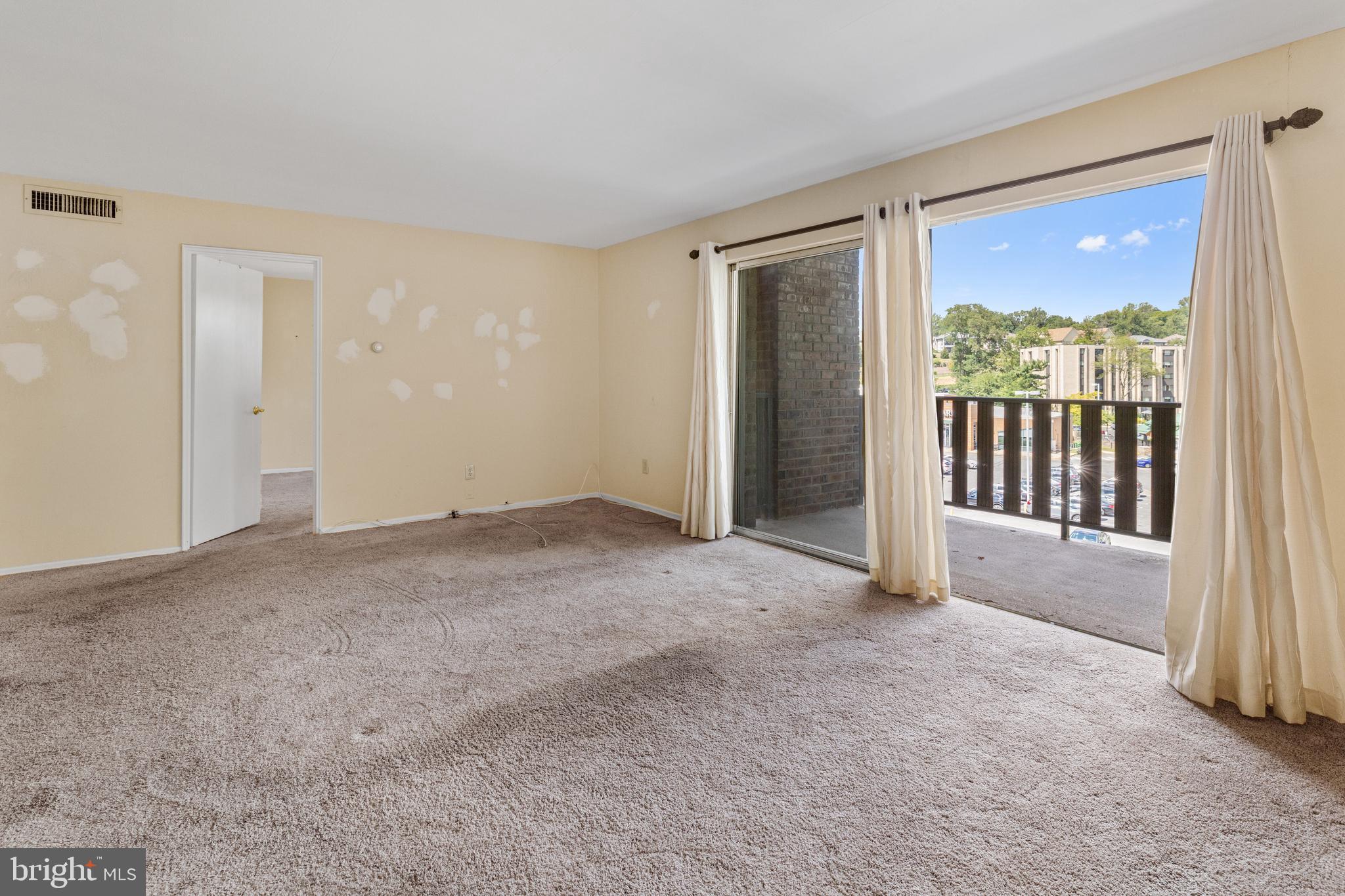 1570 The Fairway, Unit 402E Jenkintown, PA 19046 - Photo 8 of 20 Living room facing balcony.