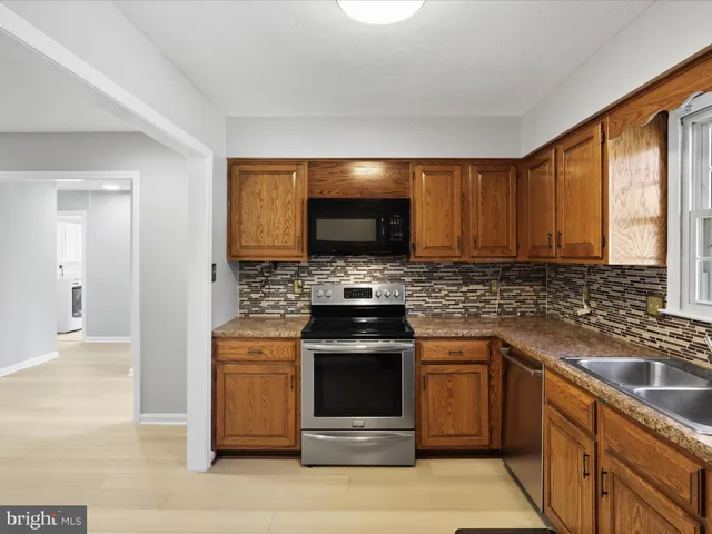 a kitchen with a stove and a sink