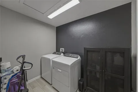 a spacious bedroom with a bed and a window