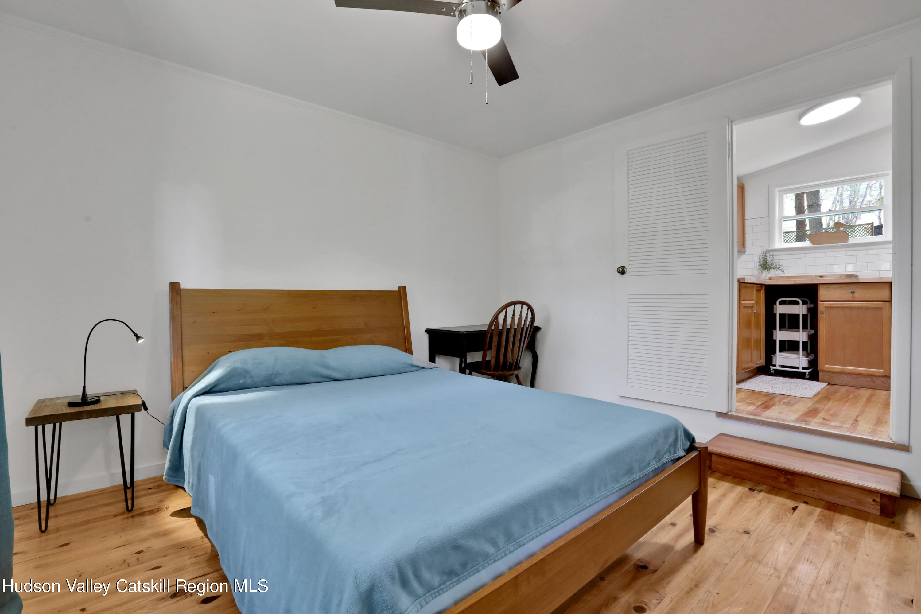 26 Beach Road Lumberland, NY 12737 - Photo 12 of 22 a bedroom with a bed and wooden floor