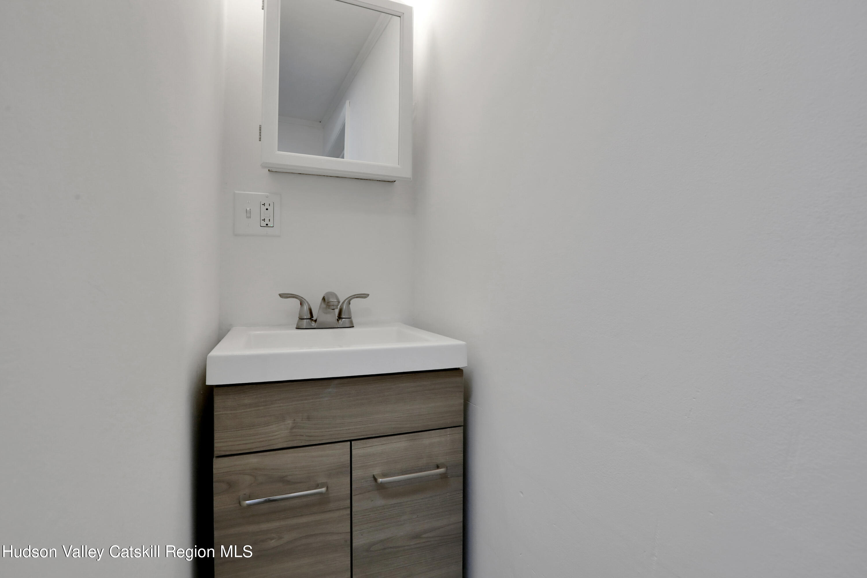 26 Beach Road Lumberland, NY 12737 - Photo 14 of 22 a bathroom with a sink and a mirror