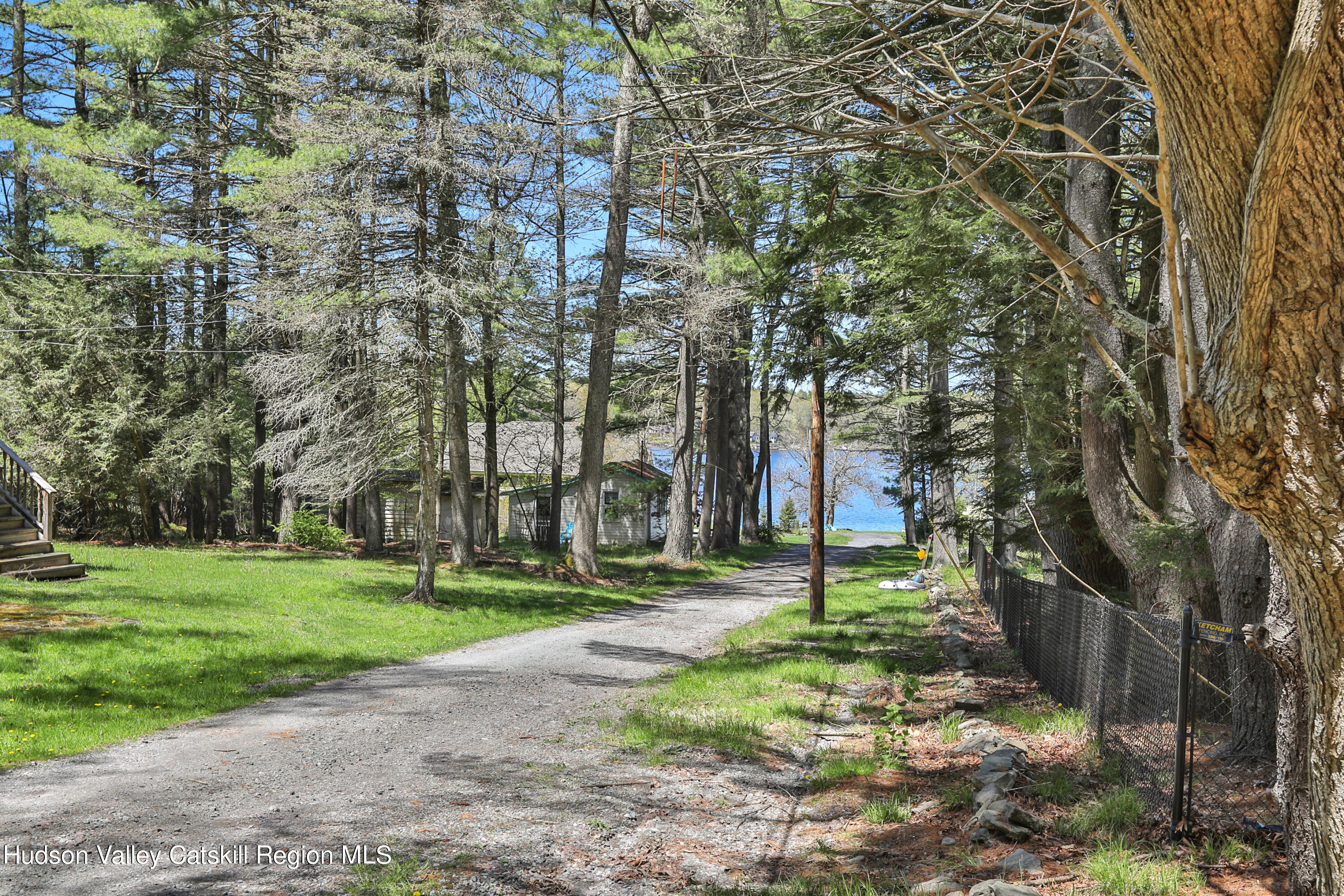 26 Beach Road Lumberland, NY 12737 - Photo 18 of 22 a garden with trees in front of it
