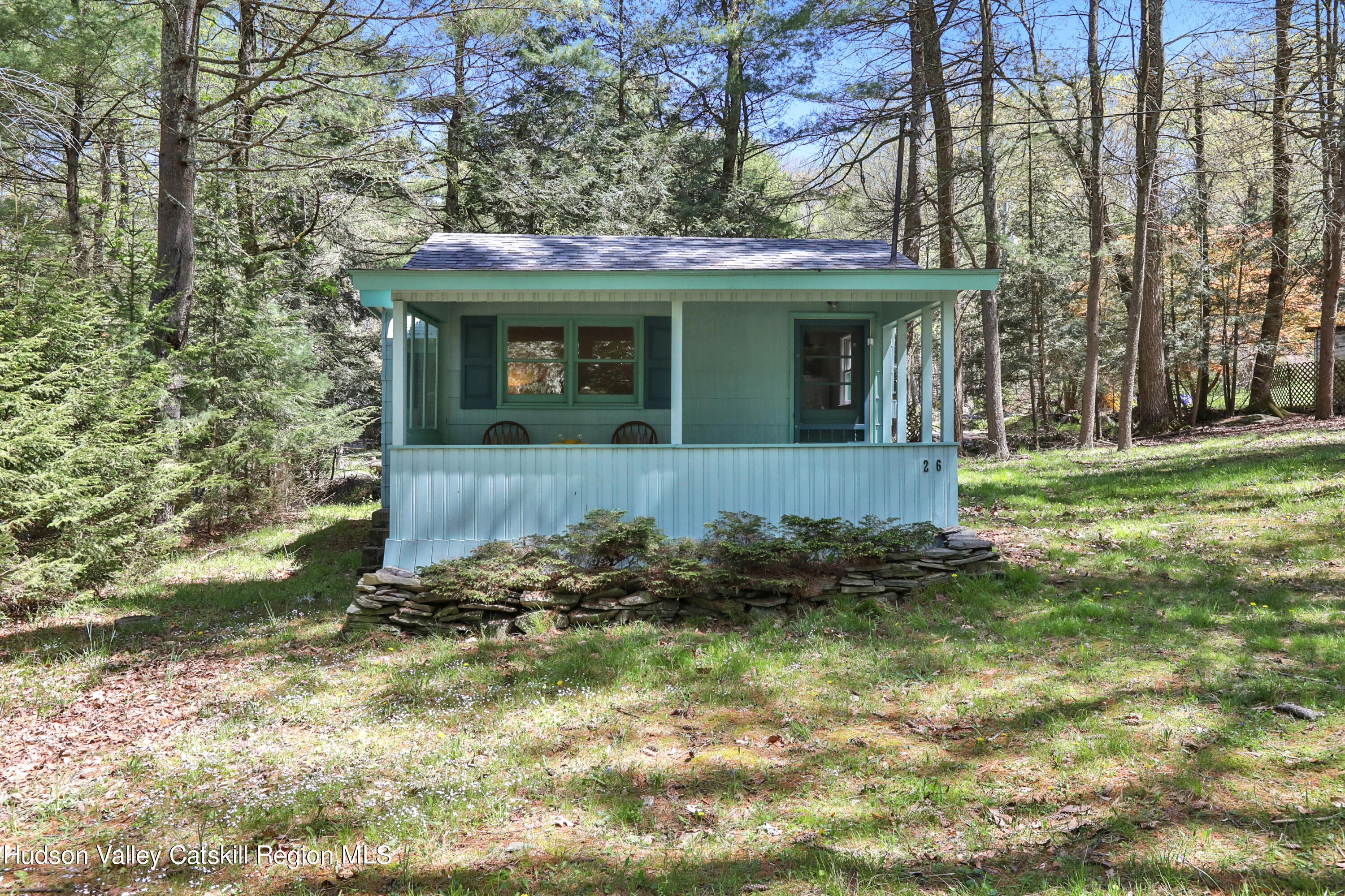 26 Beach Road Lumberland, NY 12737 - Photo 2 of 22 a front view of a house with a yard